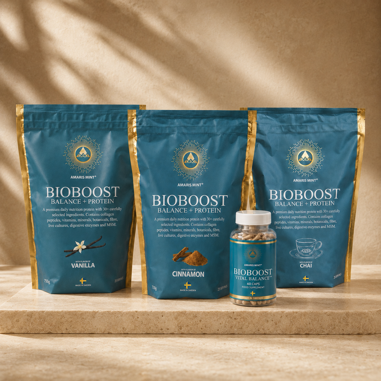 Three bags of Arawak Way Bioboot Balance + Protein powder in vanilla, cinnamon, and chai flavors, alongside a small bottle of the same protein powder, arranged on a stone surface against a warm beige background with soft leaf shadows.