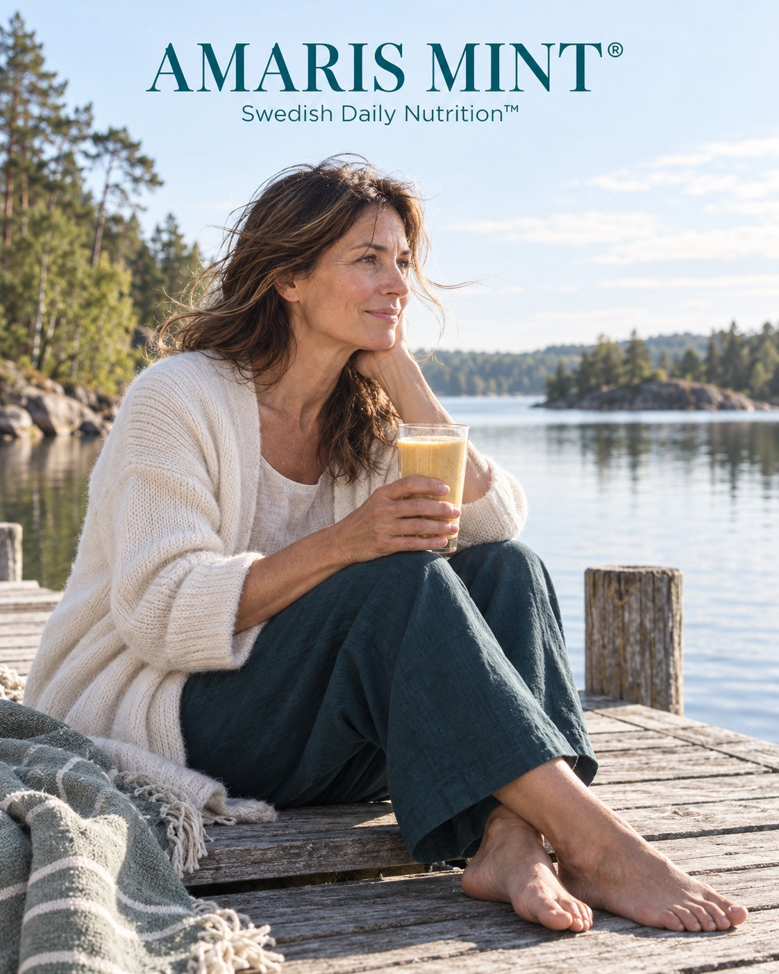 AI-generated lifestyle image of a woman holding a pale golden shake while sitting on a wooden jetty beside a lake. Amaris Mint — Swedish Daily Nutrition.