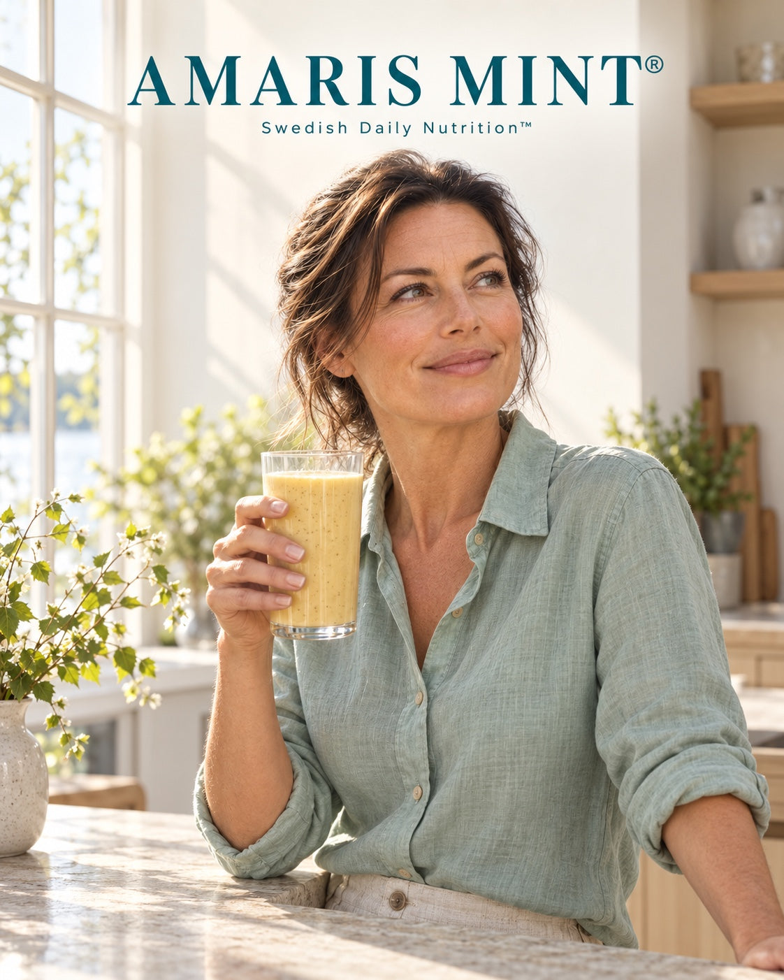 AI-generated lifestyle image of a woman in a sage linen shirt holding a pale golden shake in a sunlit kitchen. Amaris Mint — Swedish Daily Nutrition.