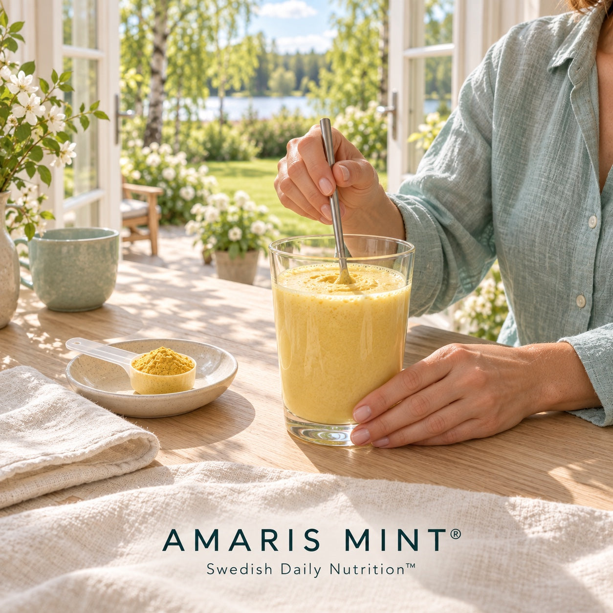 Amaris Mint daily nutrition shake being stirred beside a scoop of protein powder