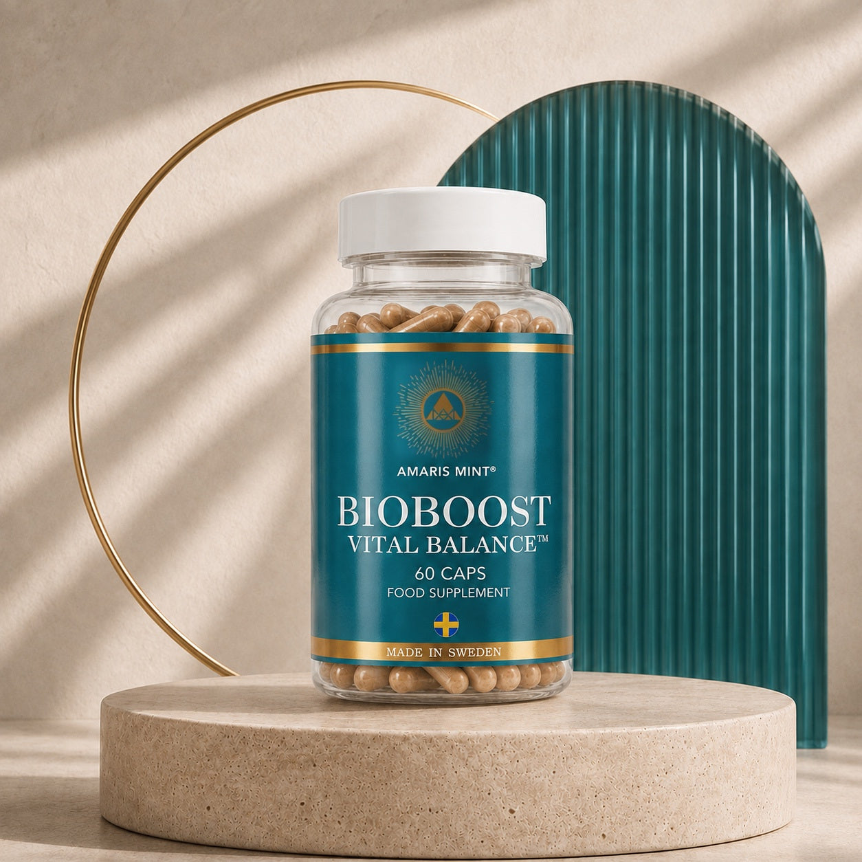 Amaris Mint® BioBoost Vital Balance™ food supplement bottle in a cream, teal and gold studio setting.